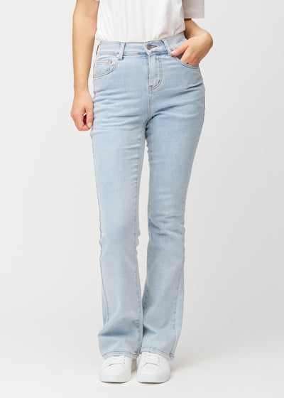 Light blue mid-rise bootcut jeans in Waves. Front view on a model, fitted through the hips and thighs with a gentle flare at the hem.