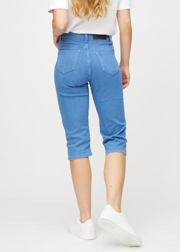 Blue regular capris seen from the back, so the entire product can be seen.