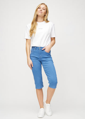 Full image of a model in blue regular capris.