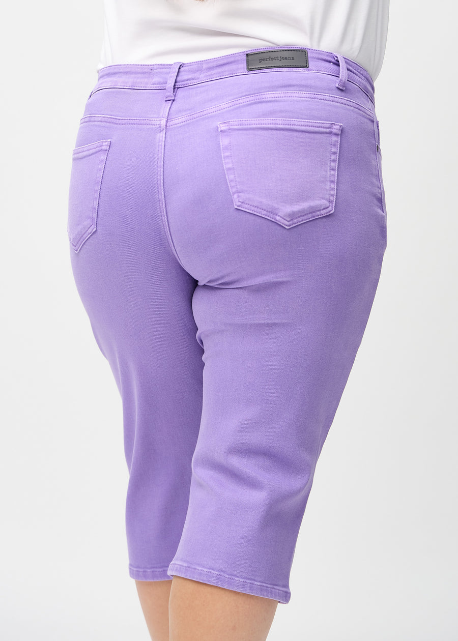 Purple regular capris seen from the back close up on a plus-size model to show details.