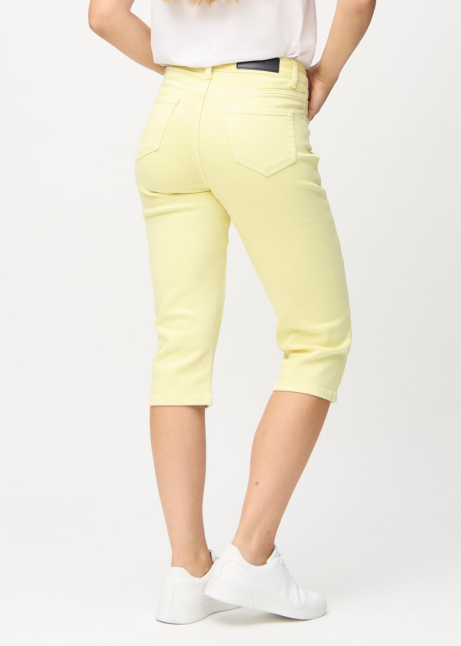 Light yellow regular capris seen from the back, so the entire product can be seen.
