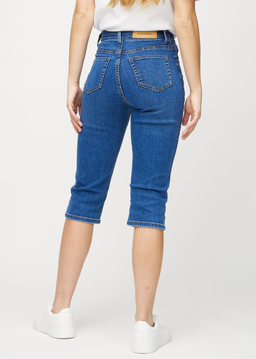 Dark denim regular capris seen from the back, so you can see the entire product.
