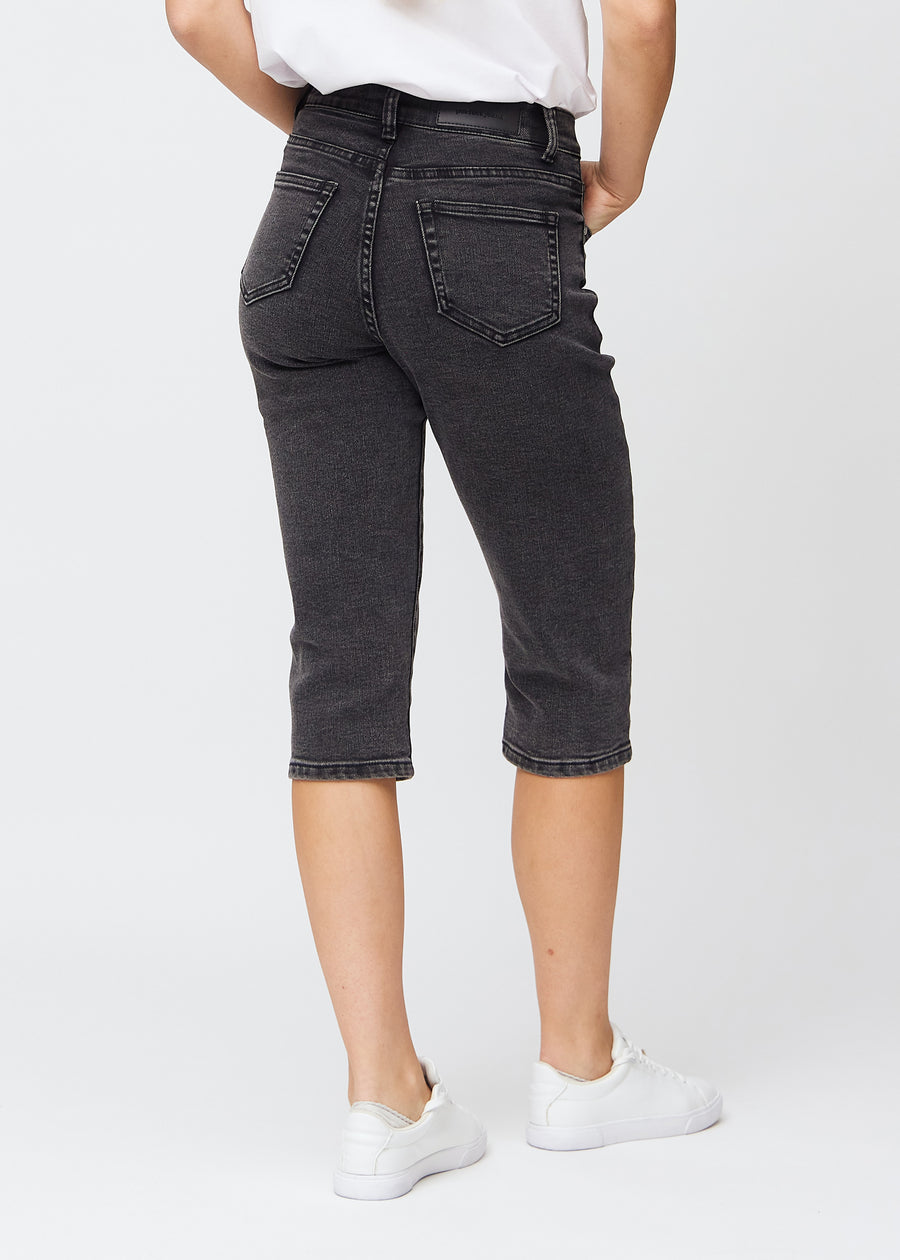 Dark grey denim regular capris seen from the back, so the full product can be seen.