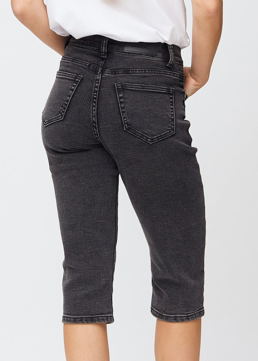 Dark grey denim regular capris seen from the back close up to show details.