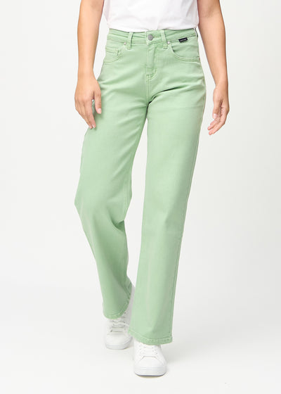 Loose jeans for women in light green, color Mints. Front view on a model, showing the roomy, wide-leg fit.