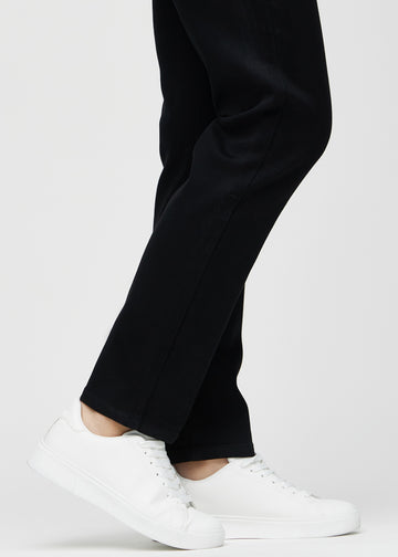 Regular jeans for women in black, color Ravens. Close-up at the ankles on a model, showing the straight leg openings.