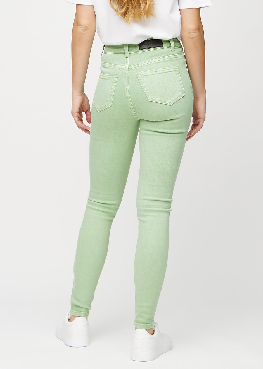 Light green skinny jeans seen from the back, so the entire product can be seen.