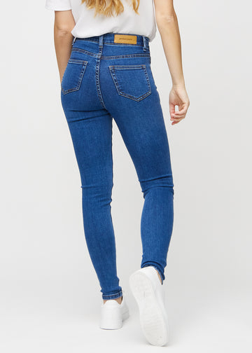 Dark denim skinny jeans seen from the back, so the entire product can be seen.