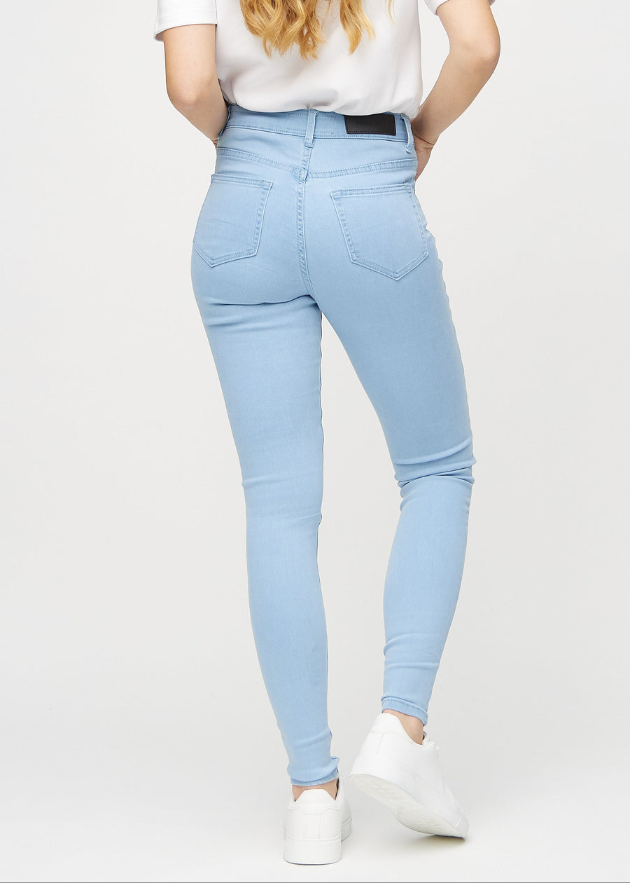 Skinny jeans for women in light blue, color Skies. Back view on a model, showing the overall fit.