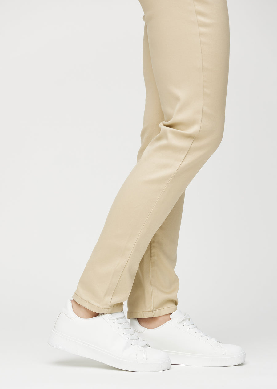 The ankles of a model, so you can see how tightly the jeans fit.