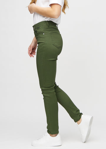 Slim jeans for women in dark green, color Renewals. Side view on a model.