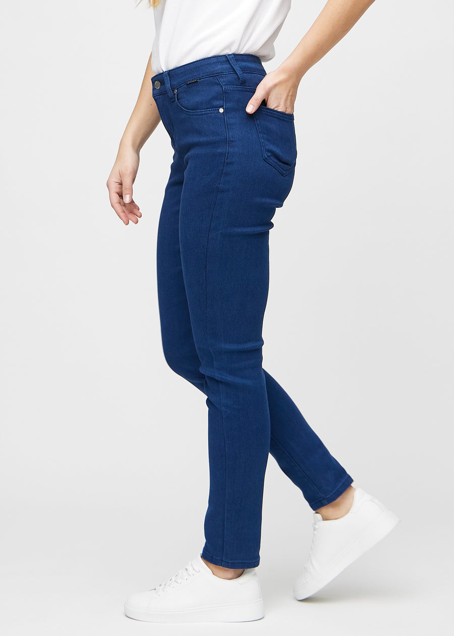 Slim jeans for women in dark blue, color Royals. Side view on a model.