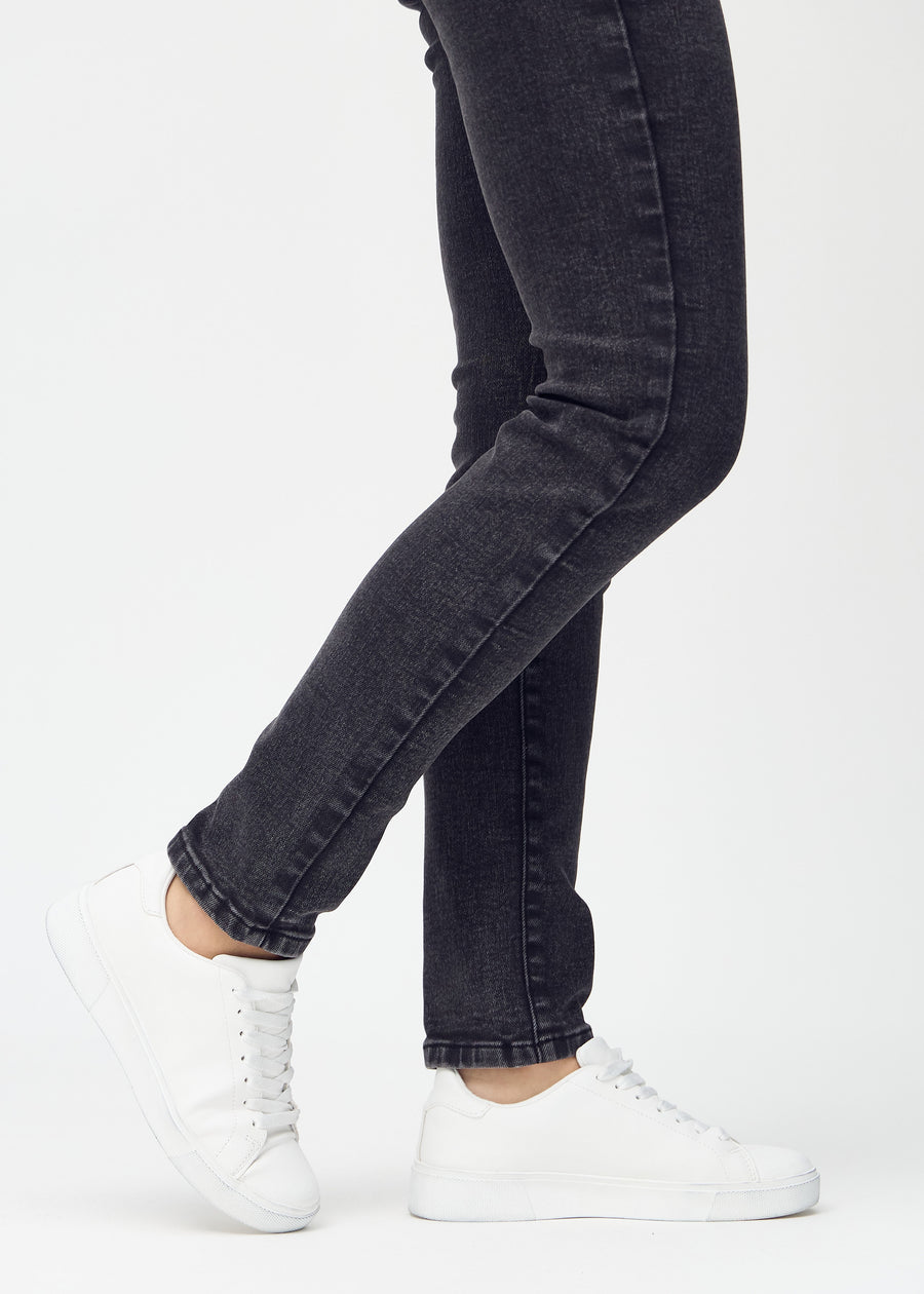 Slim jeans for women in dark grey, color Shadows. Close-up at the ankles on a model, showing the fit at the leg openings.