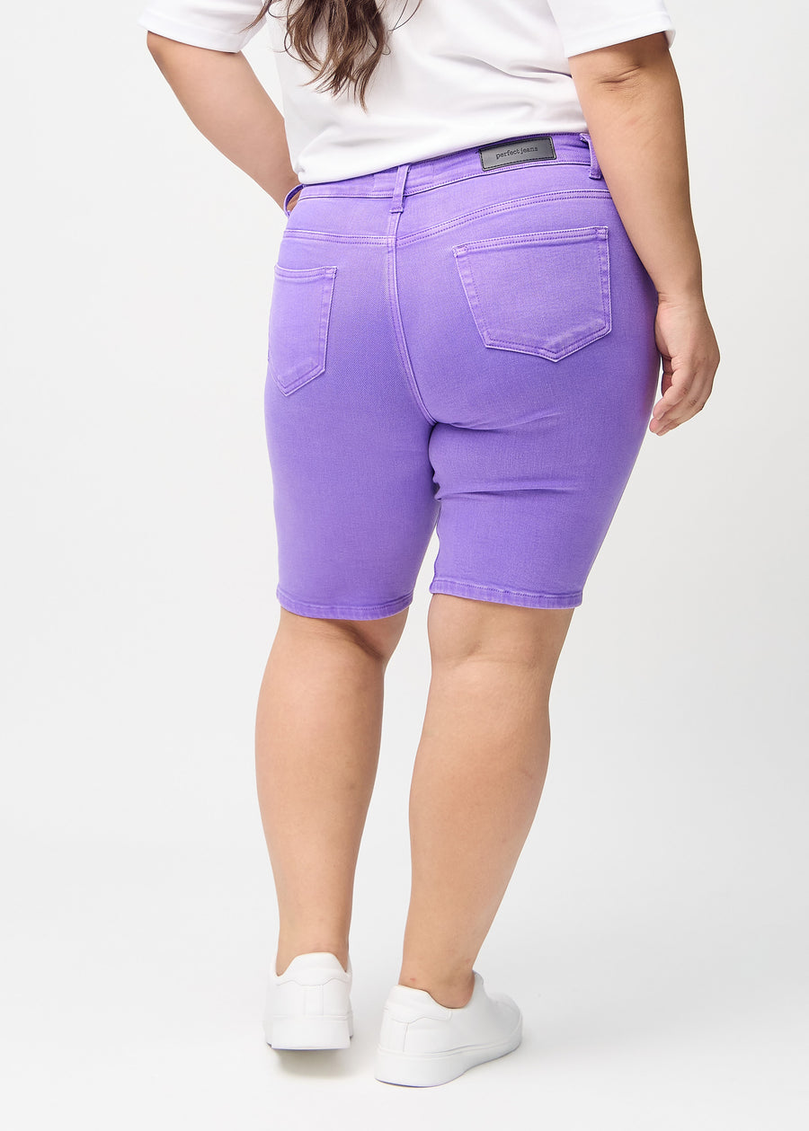 Purple skinny middle shorts seen from the back on a plus-size model, so the entire product can be seen.