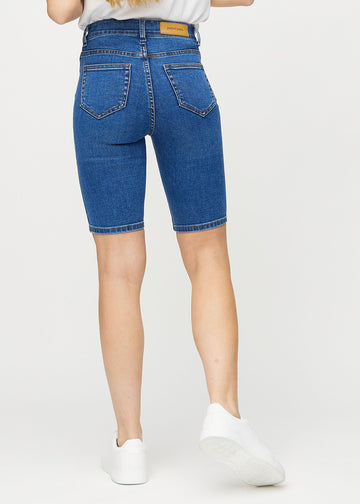 Dark denim skinny middle shorts seen from the back, so the full product can be seen.