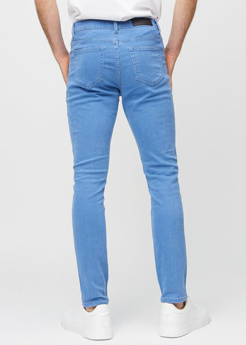 Blå slim jeans set bagfra, så man kan se hele produktet.
