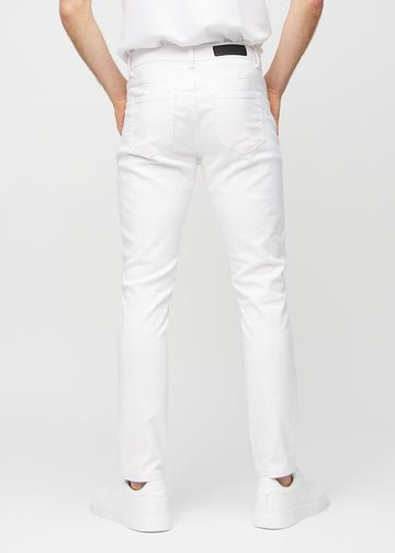 White slim jeans viewed from the back to show the full product.