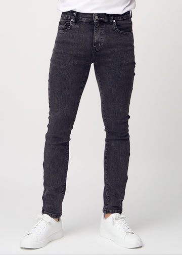 Dark grey denim slim jeans, model name Shadows, fitted closely along the legs , front view.