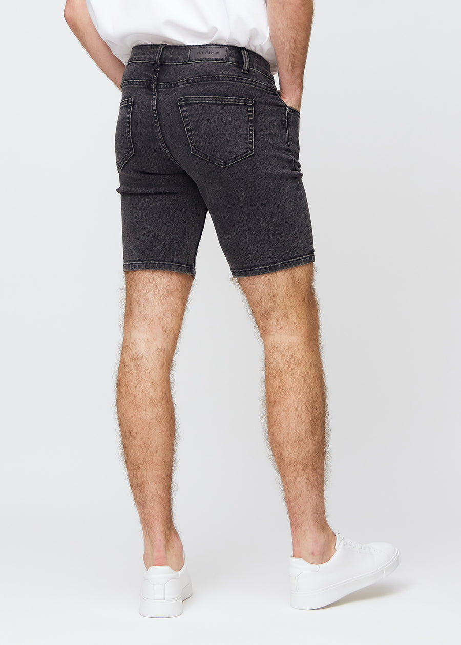Dark grey denim middle-slim shorts seen from the back, so the entire product can be seen.